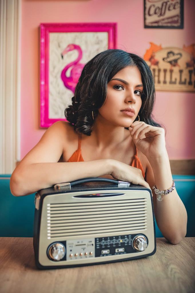 photo of woman leaning on vintage radio 2800562 lowres